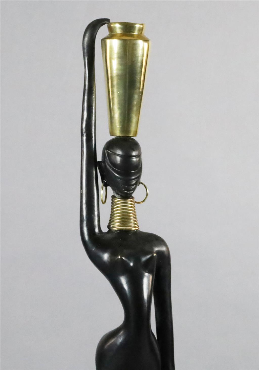 Karl Hagenauer. A brass and ebonised bronze figure of an African water carrier, height 46in.